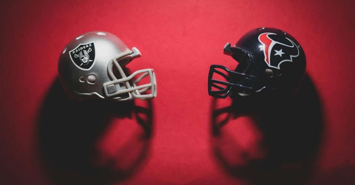 black and red helmet on red textile