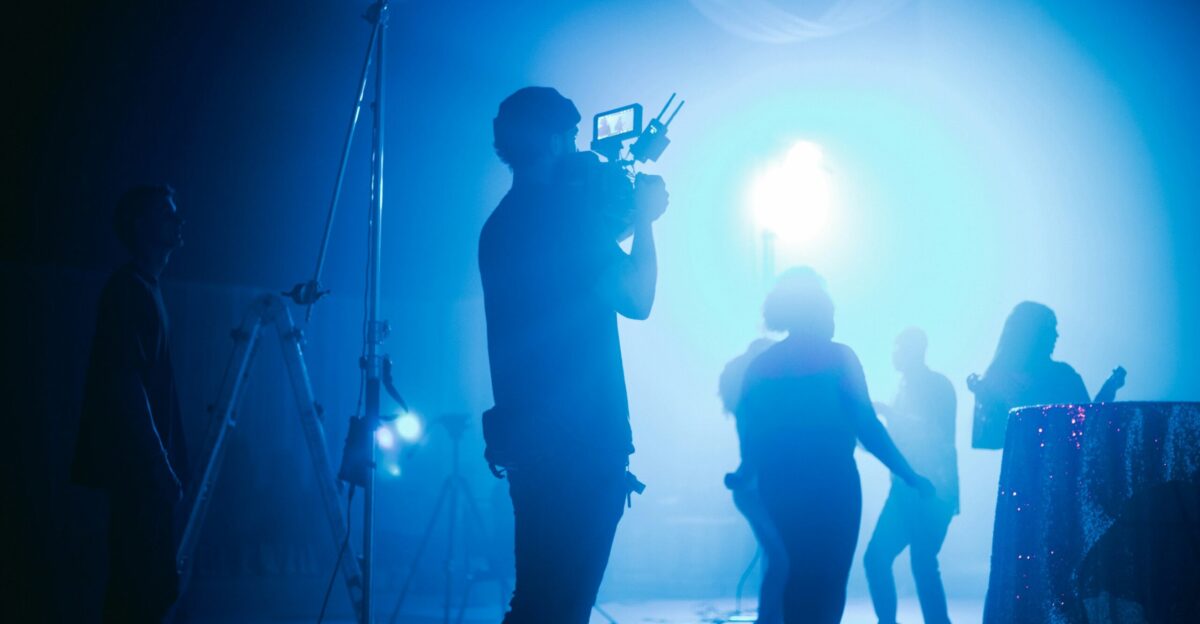 silhouette of people standing on stage
