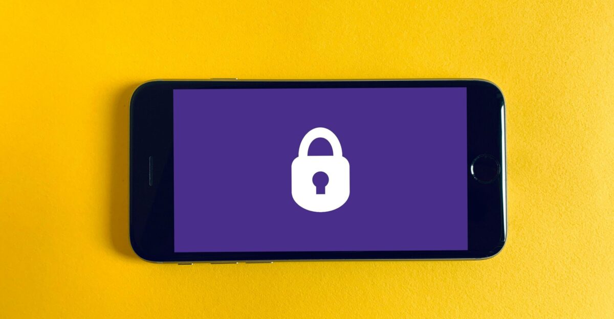 black iphone 5 on yellow textile