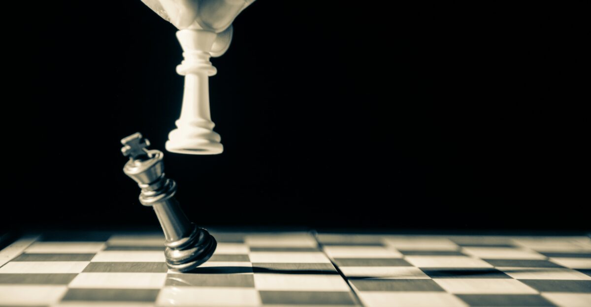 grayscale photo of person holding glass