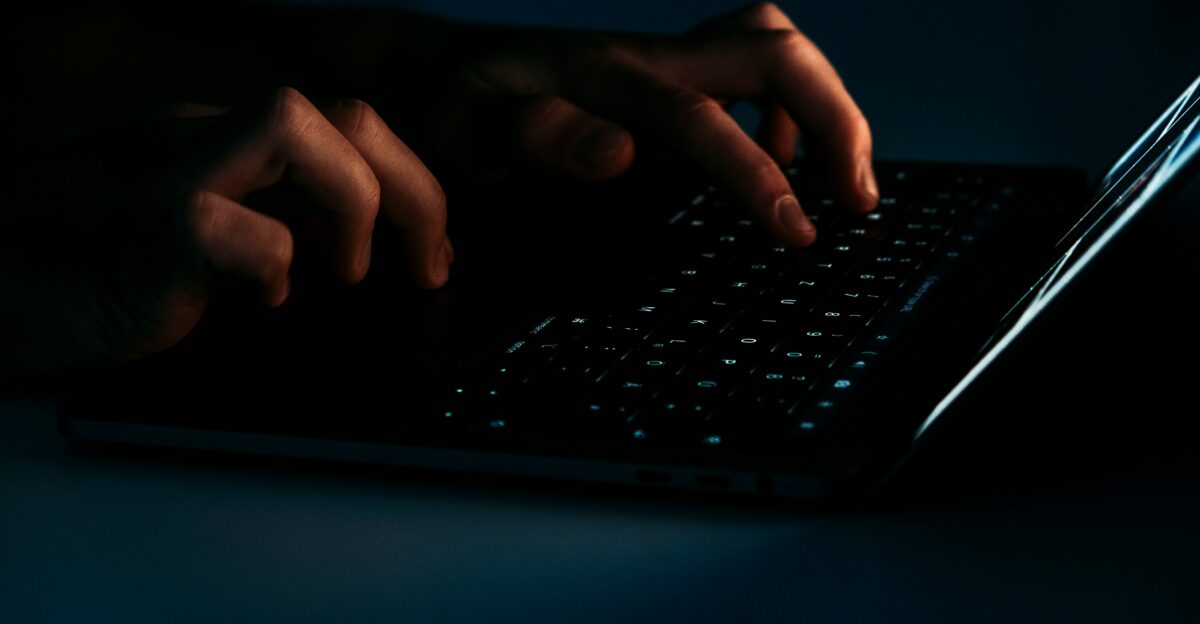 person using black laptop computer