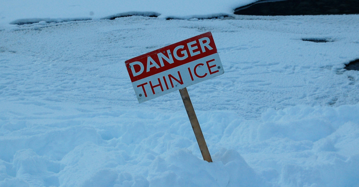 white and red open signage on snow covered ground