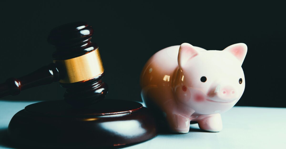 pink pig ceramic figurine on black and white round plate