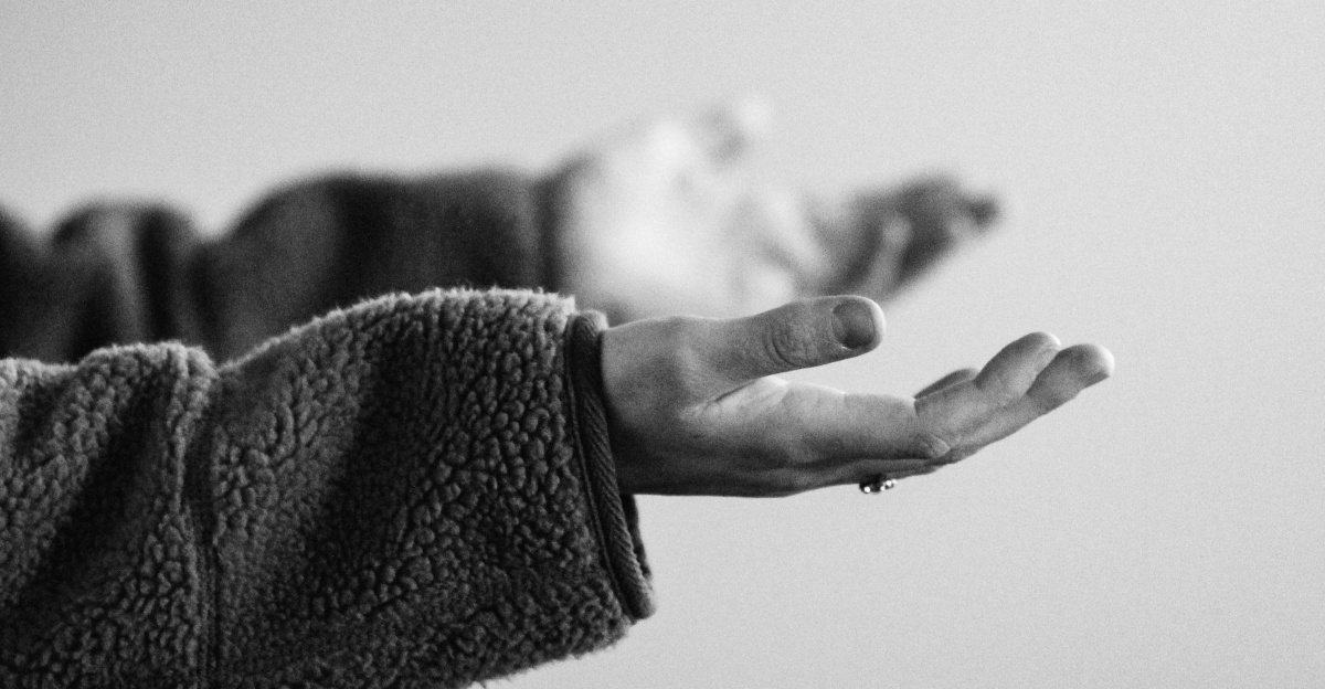 grayscale photo of persons hand