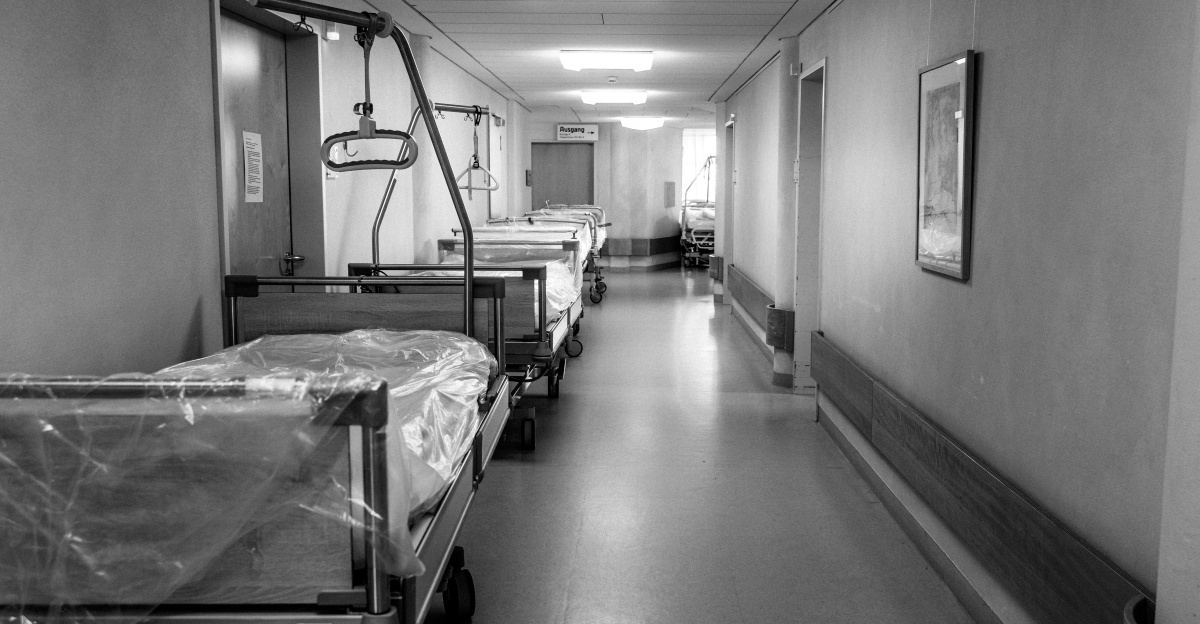 grayscale photo of hospital bed