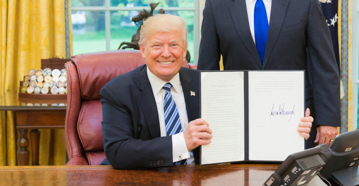 2 men in black suit sitting on red chair