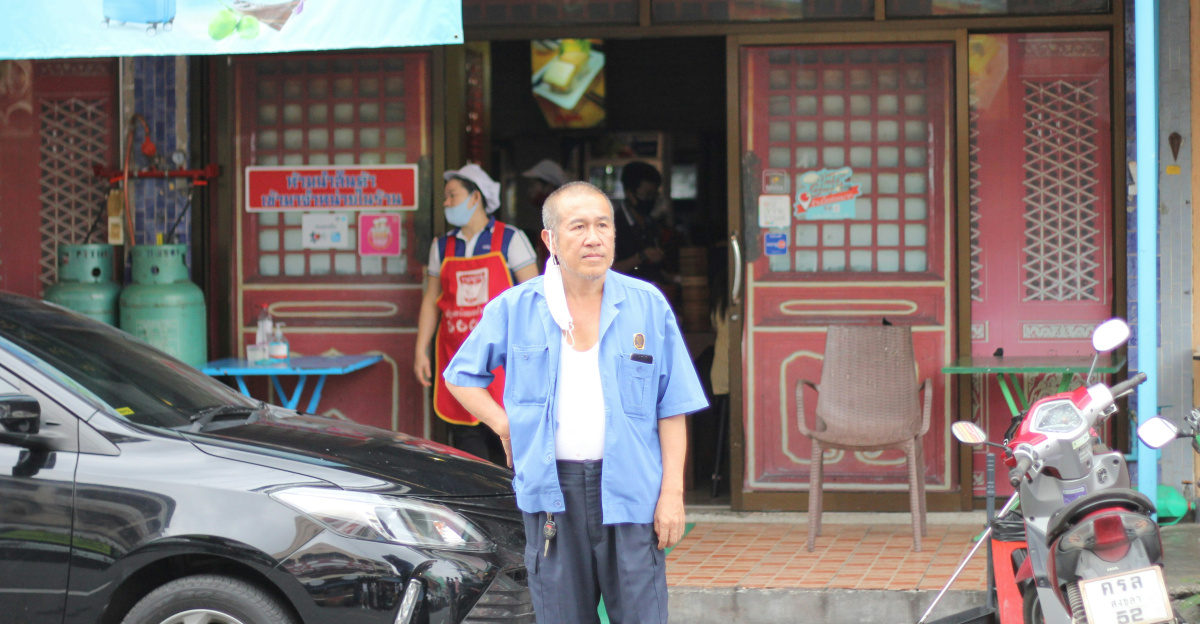 a man is standing in front of a restaurant