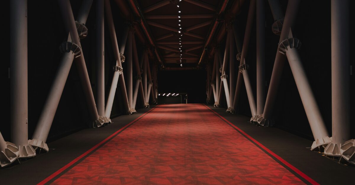 red and brown hallway with white lights