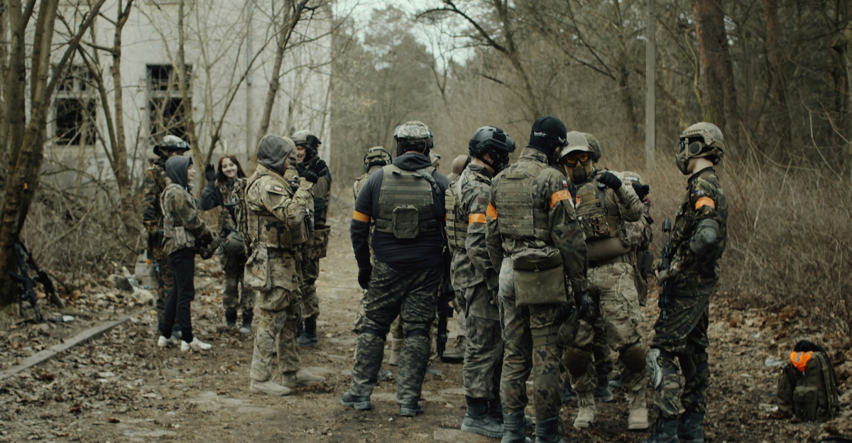 group of soldiers in camouflage uniform standing on ground during daytime