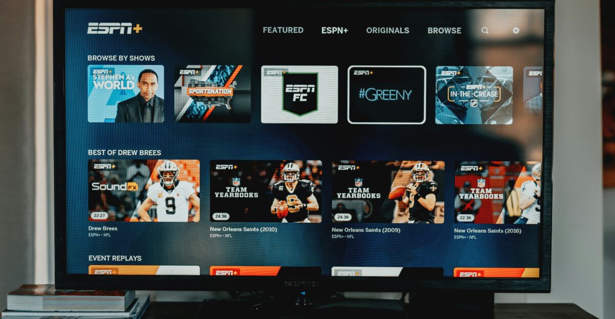 a flat screen tv sitting on top of a wooden table