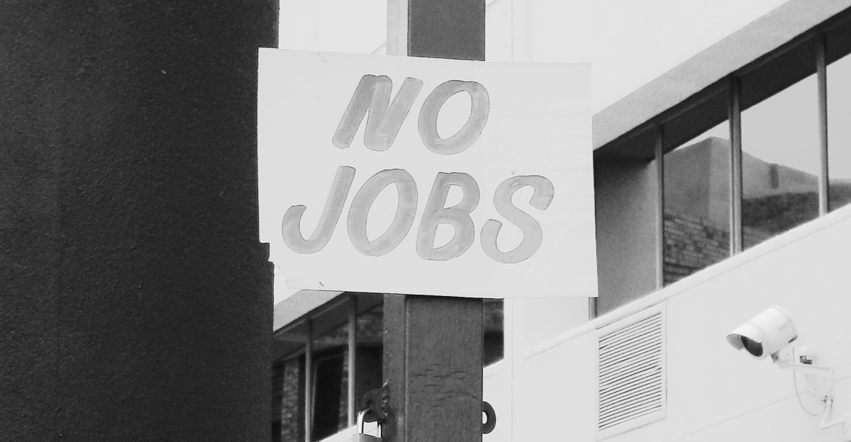 man in white dress shirt standing near white and black camera