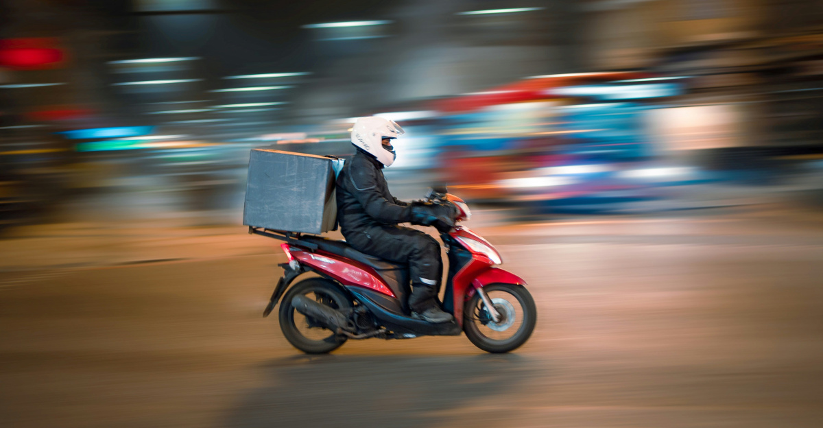 man riding motorcycle on road during daytime