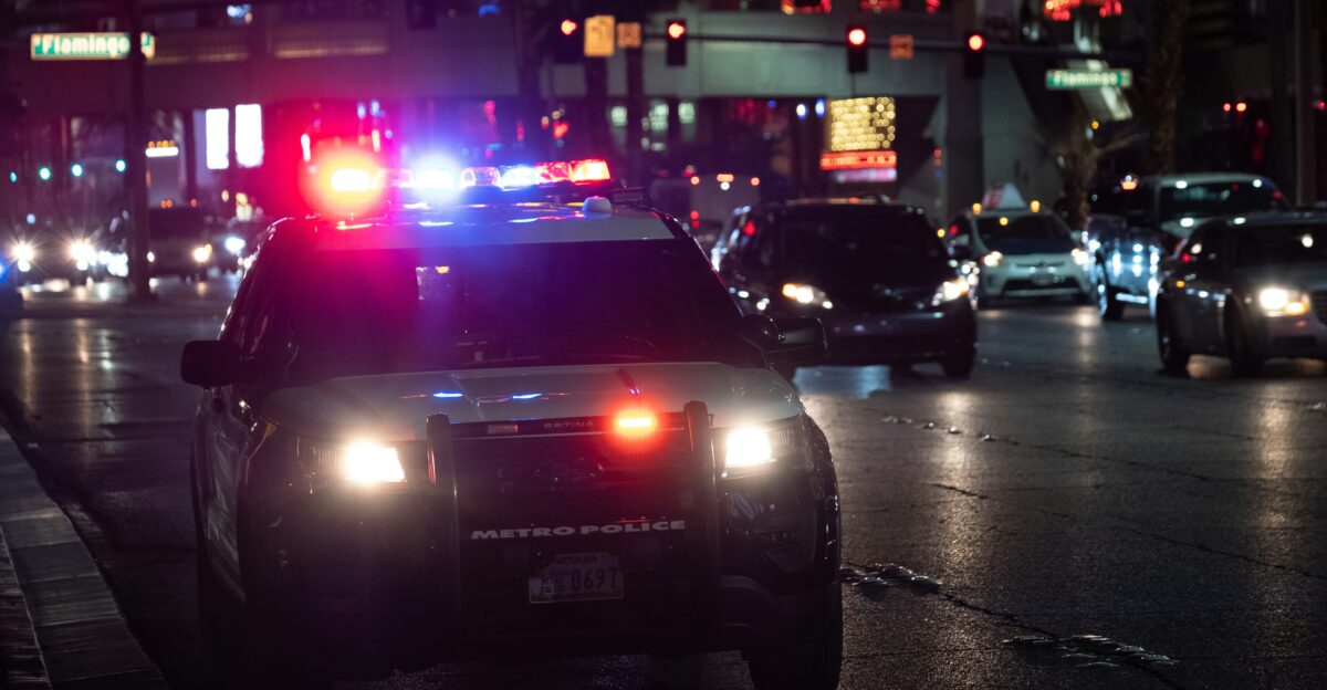 black car on road during night time