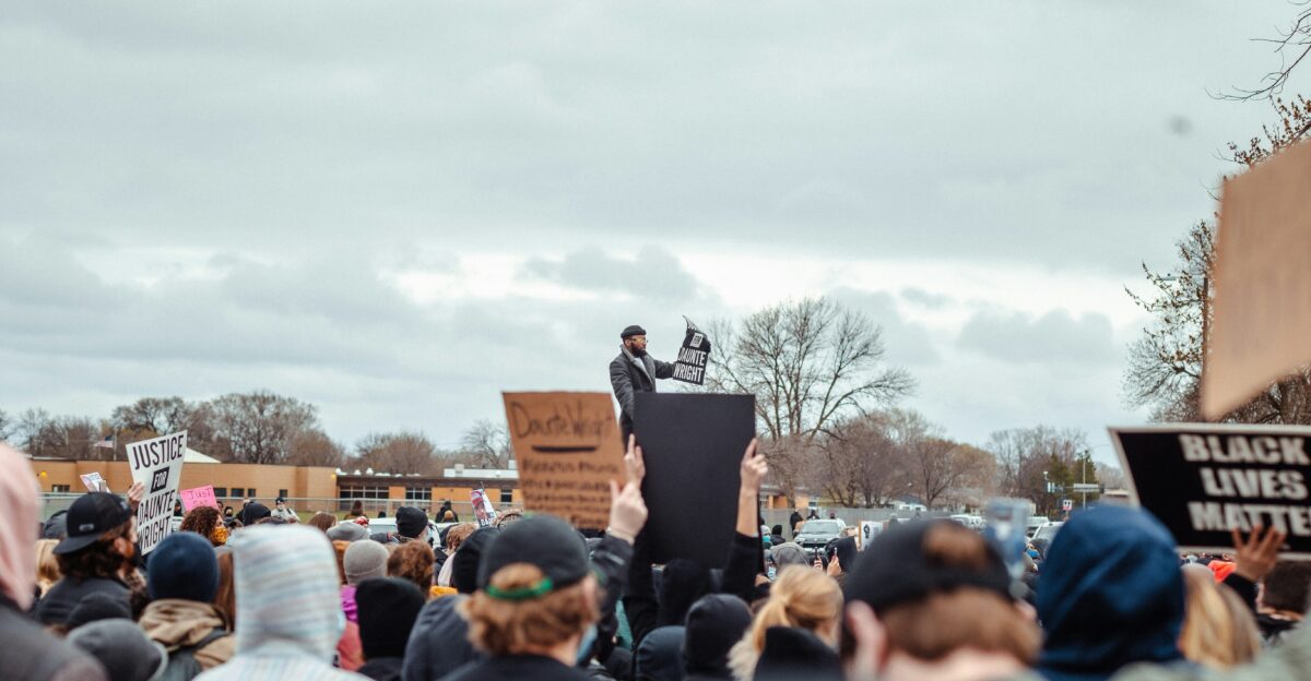 people standing on road during daytime