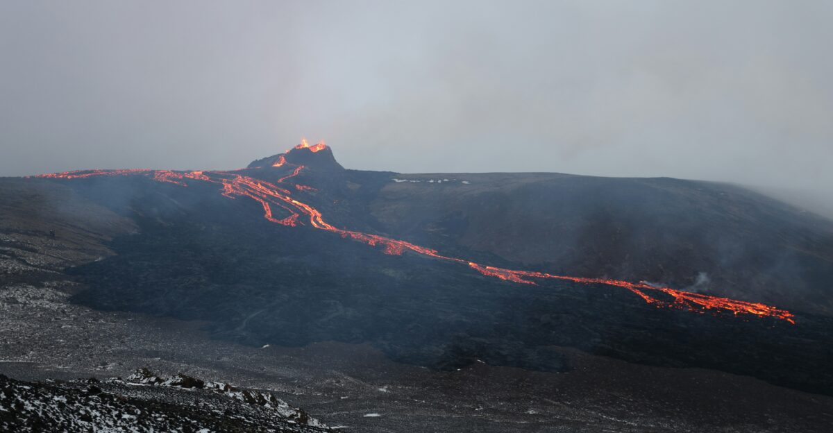 black mountain covered with fog