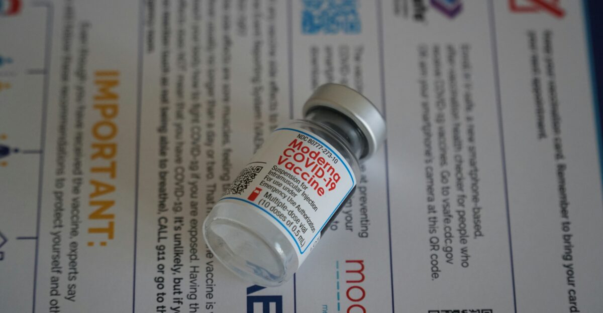 white and black labeled bottle