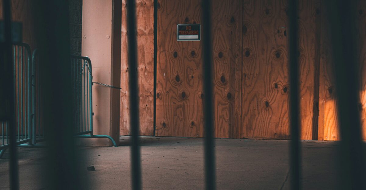 brown wooden door with white switch