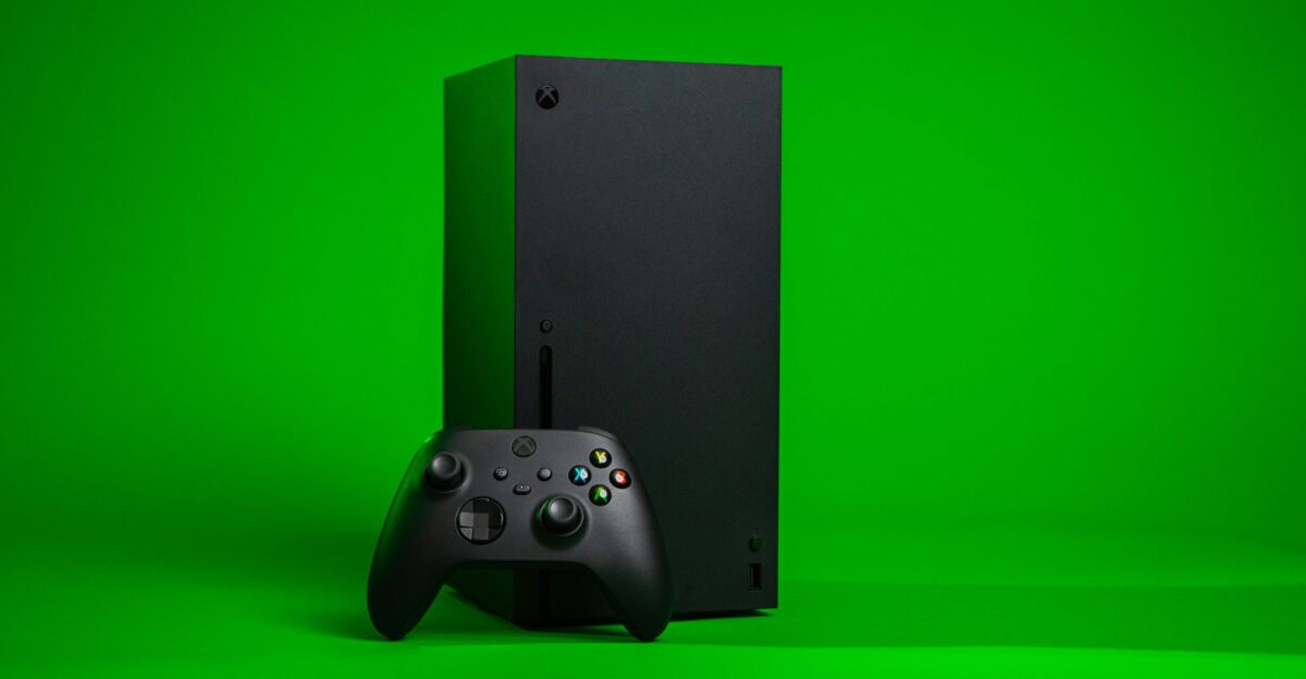 black xbox one console with controller