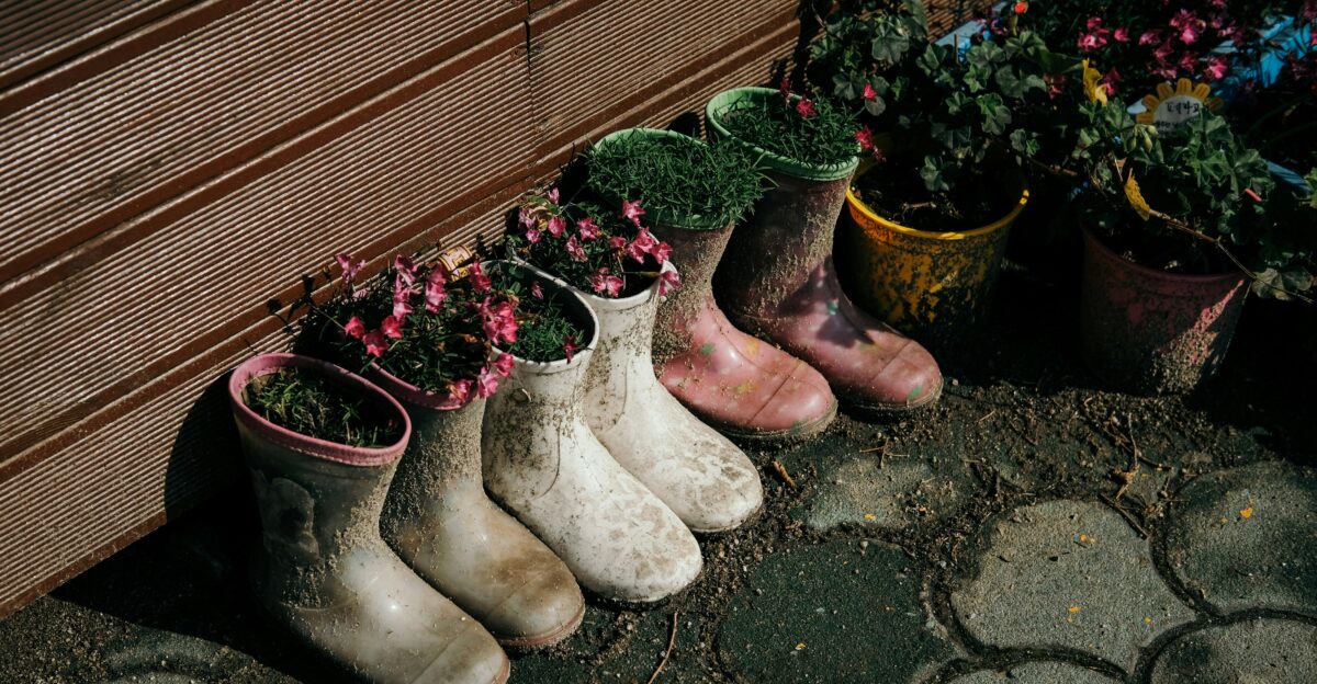 red flowers in brown ceramic vase