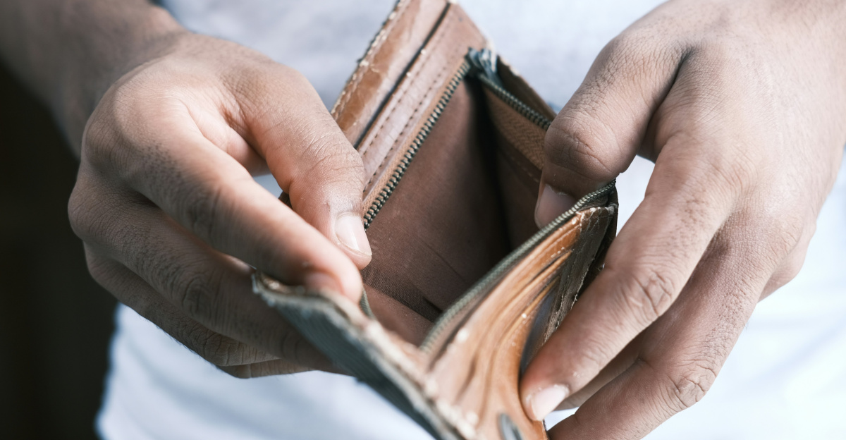 person holding brown leather bifold wallet