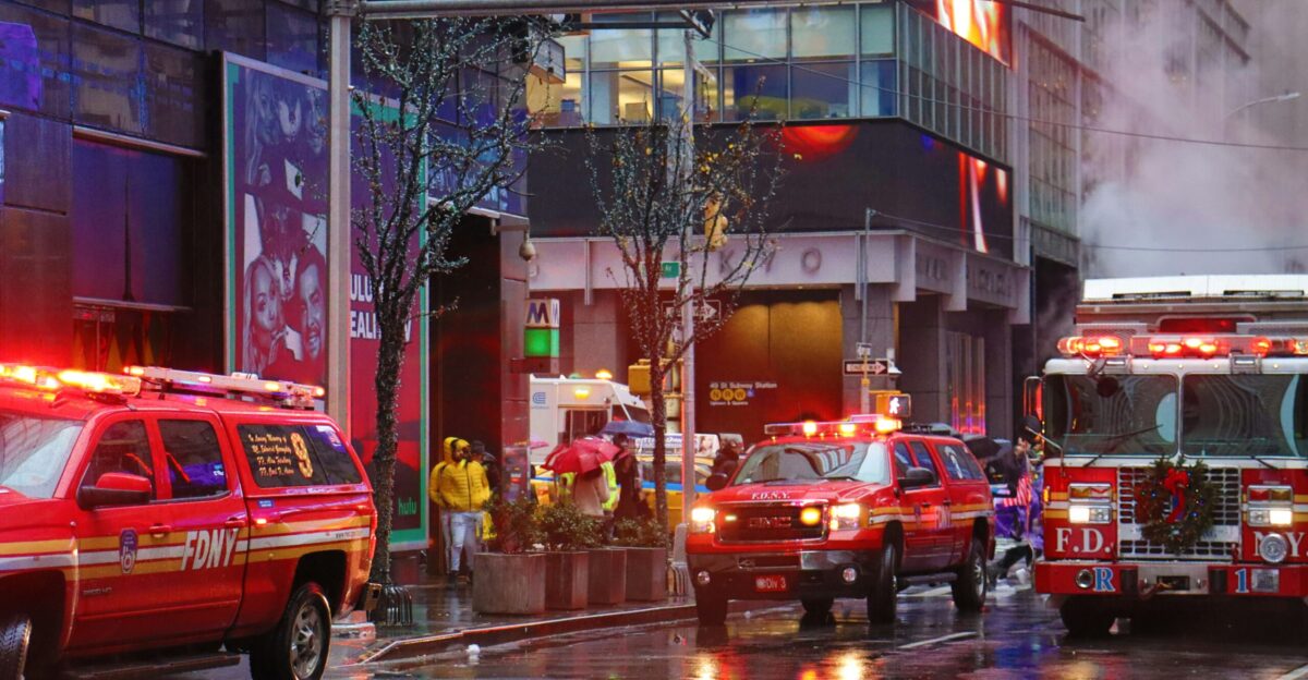 red suv on road near building during night time
