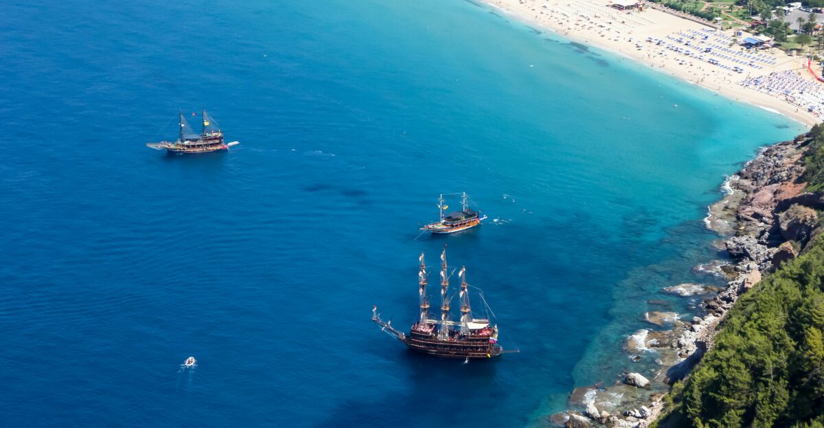 brown ship on sea during daytime