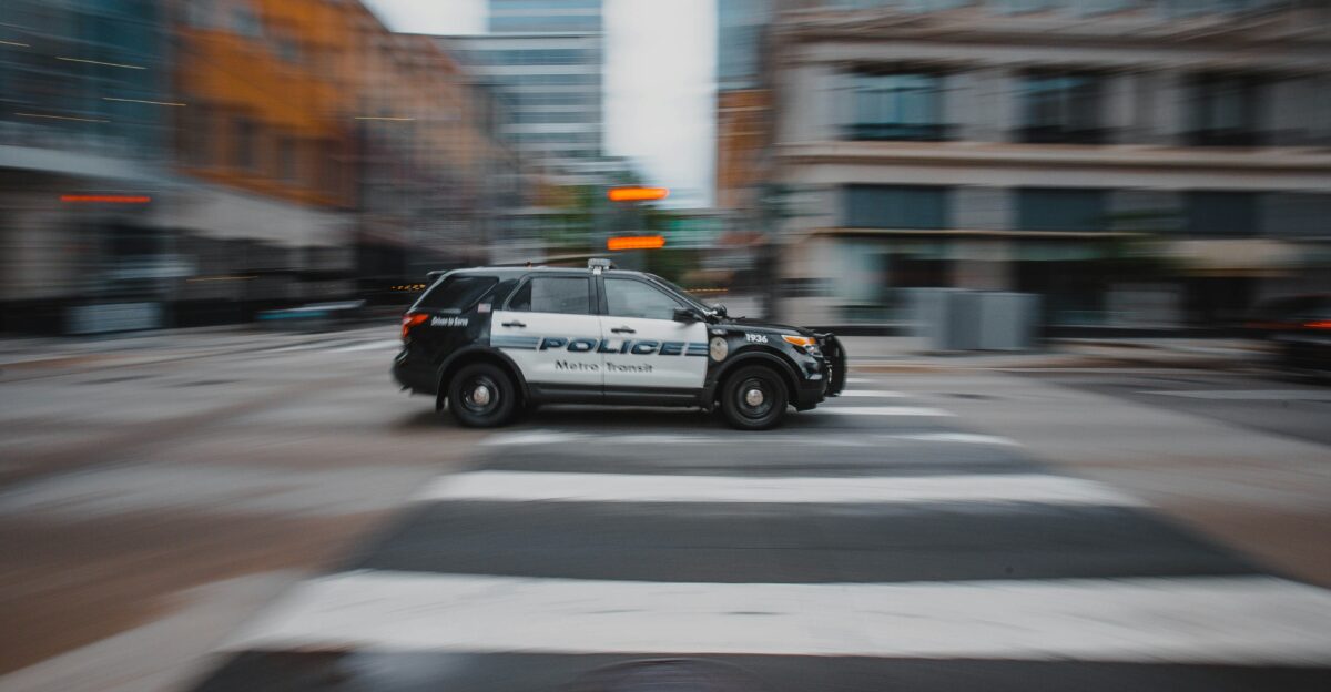 black and white police car on road during daytime