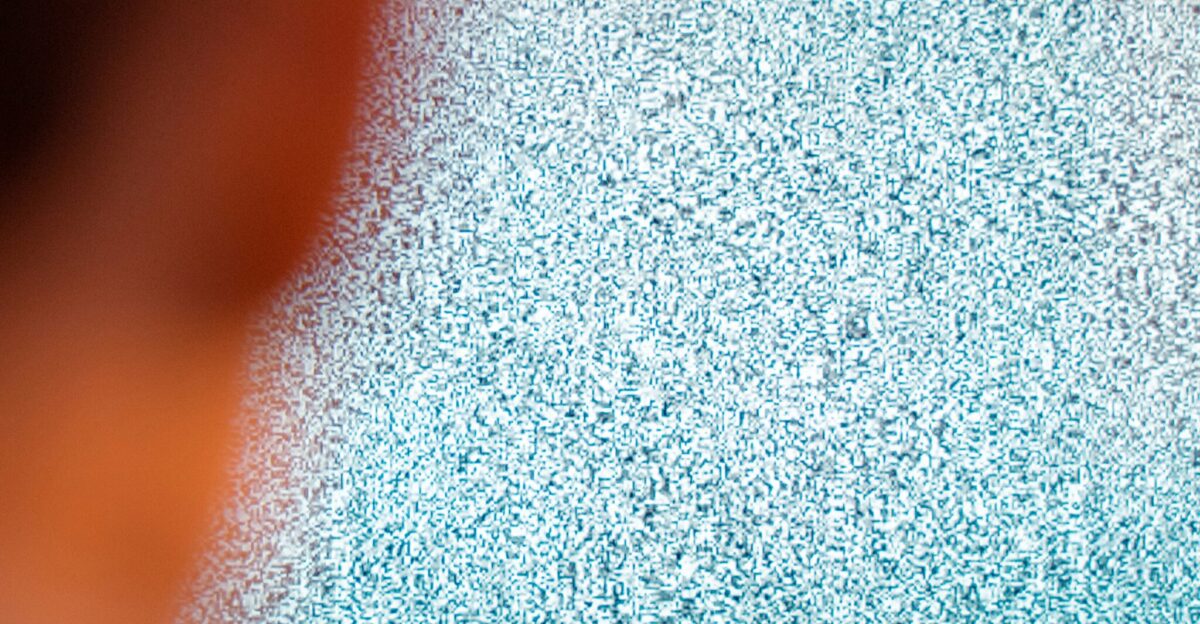 black flat screen tv turned on displaying white screen