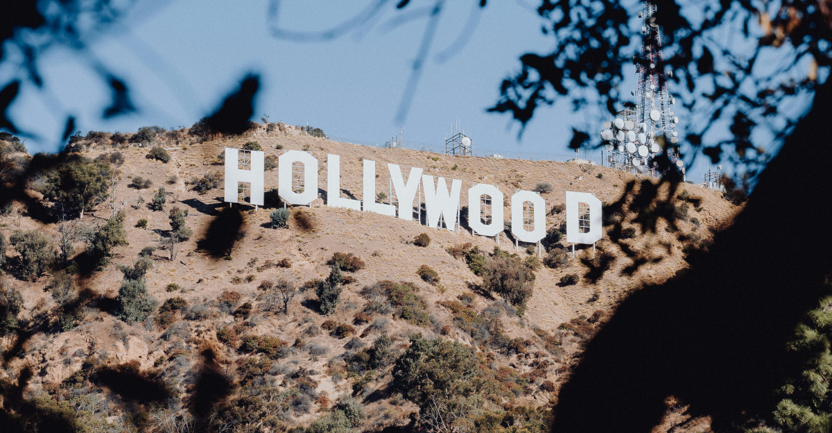 the hollywood sign is visible through the trees