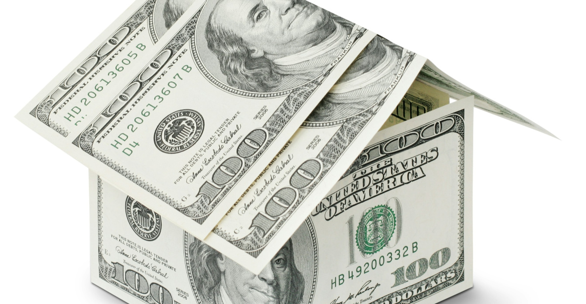 a house made out of money on a white background