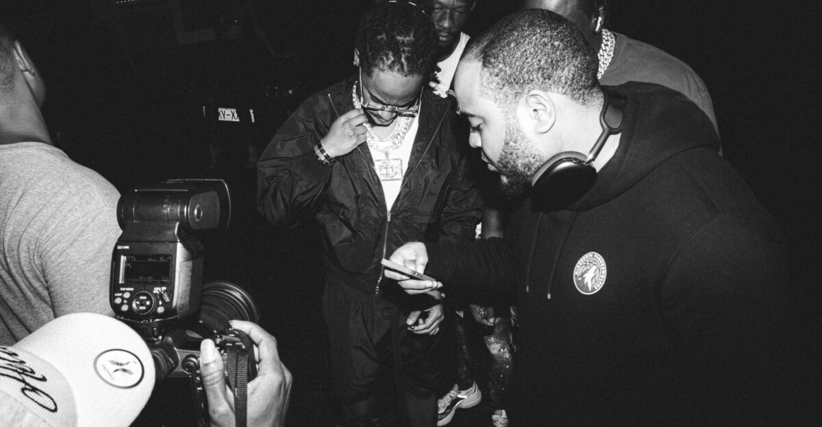 a group of people standing around each other