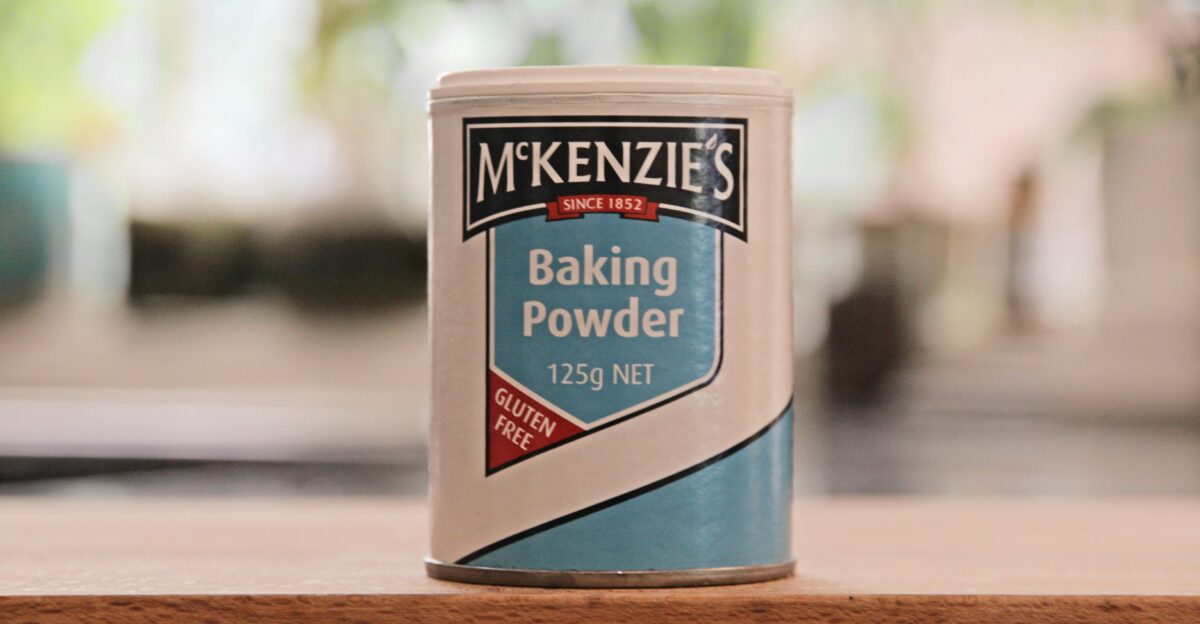 a can of baking powder sitting on a table