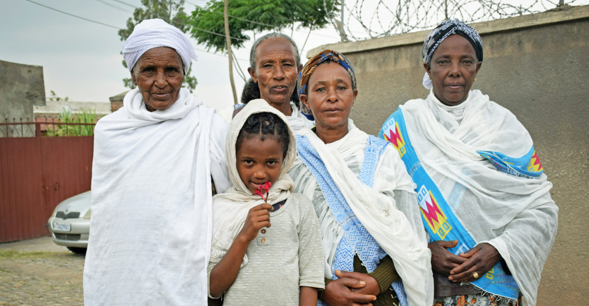 a group of women standing next to each other