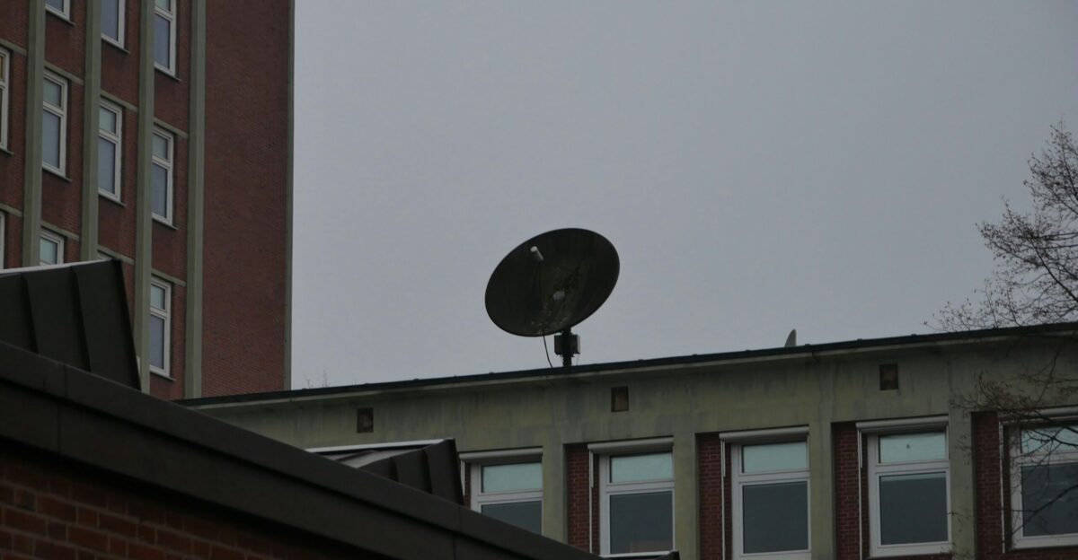 a satellite dish sitting on top of a building