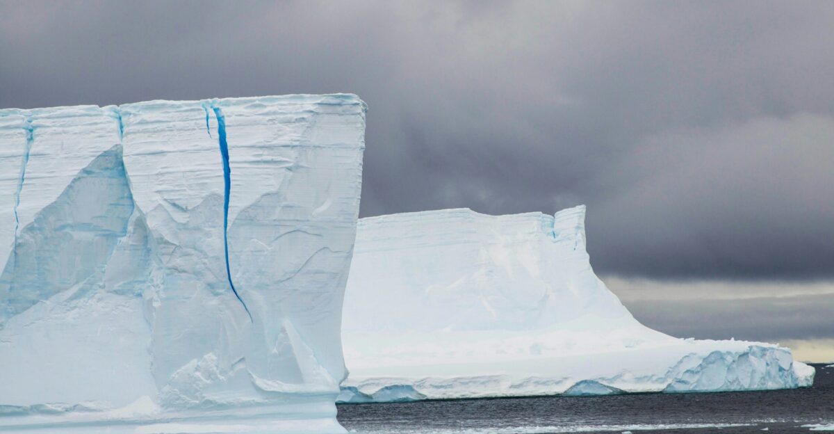 a large iceberg in the middle of a body of water