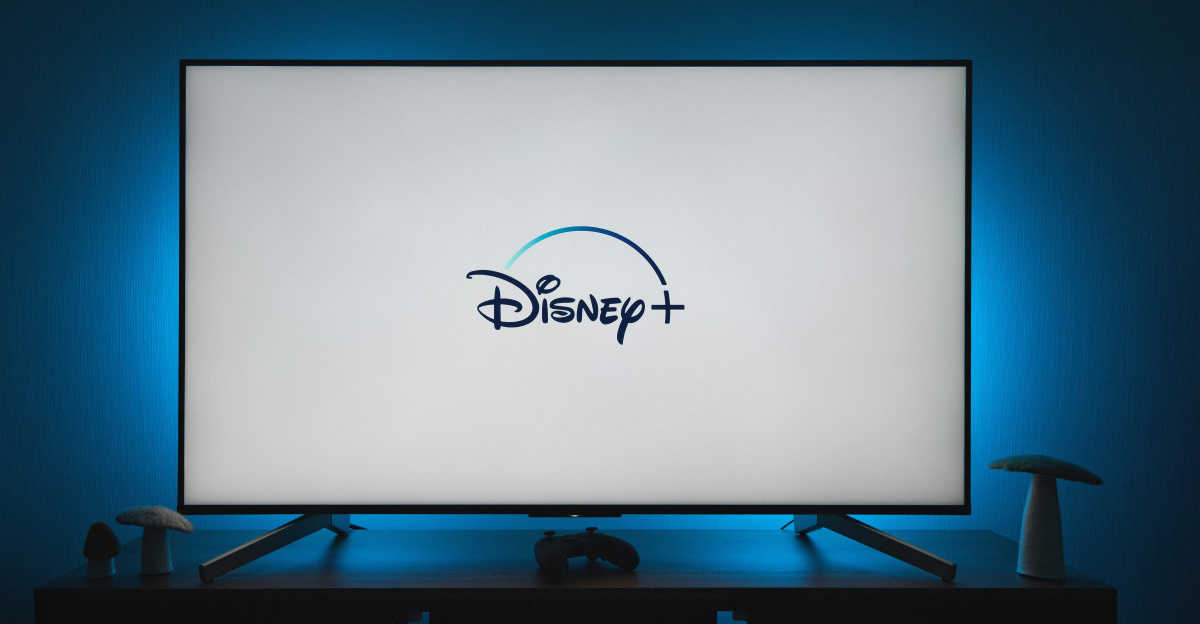 a flat screen tv sitting on top of a wooden table