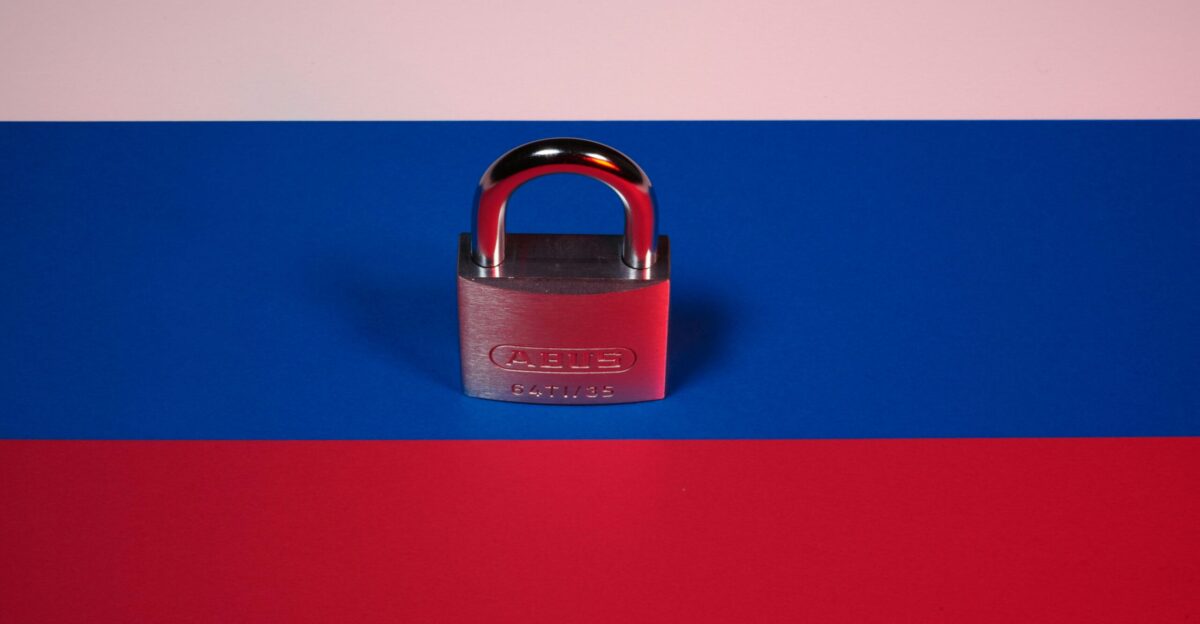 a red white and blue background with a padlock