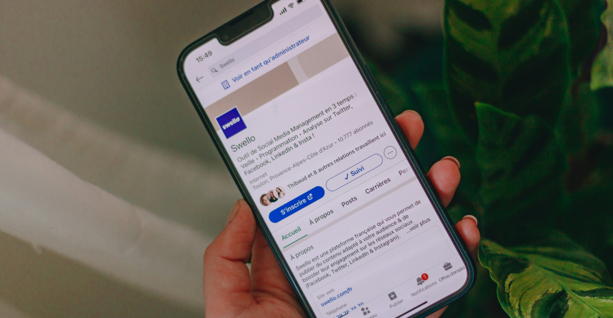 a person holding a cell phone in their hand