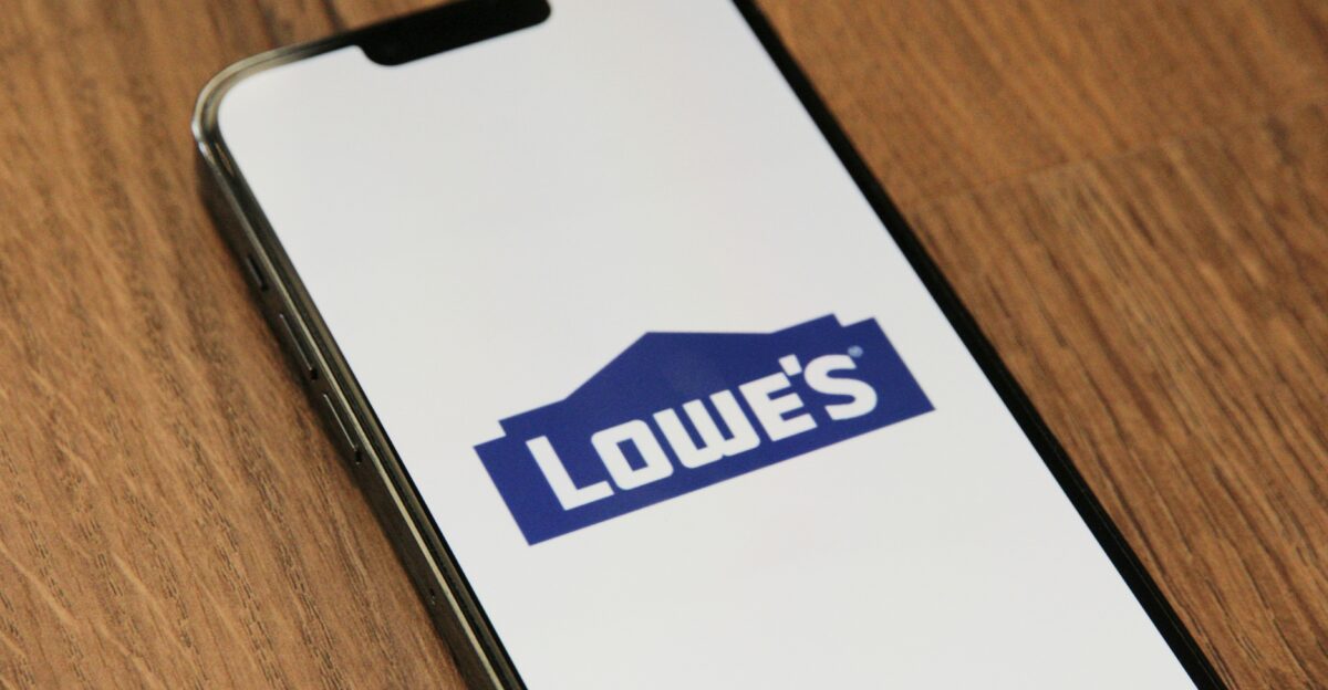 a phone with a logo on it sitting on a table