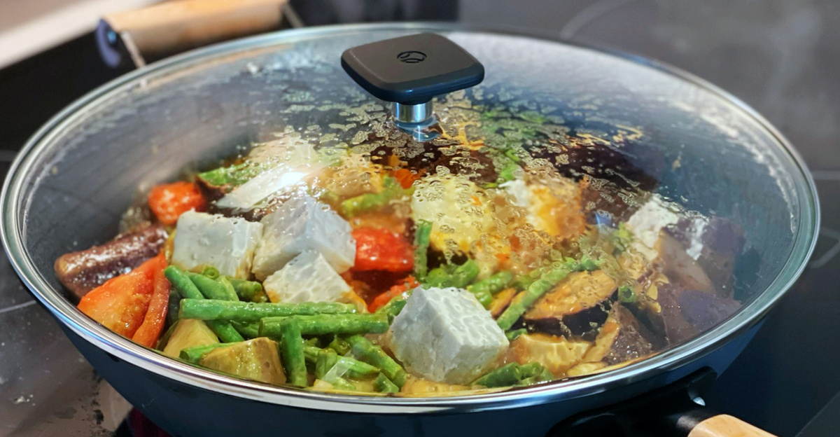 a pan of food cooking on a stove top