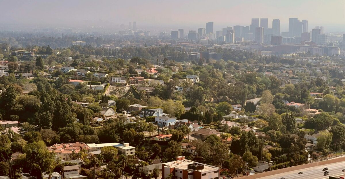 a view of a city from the top of a hill