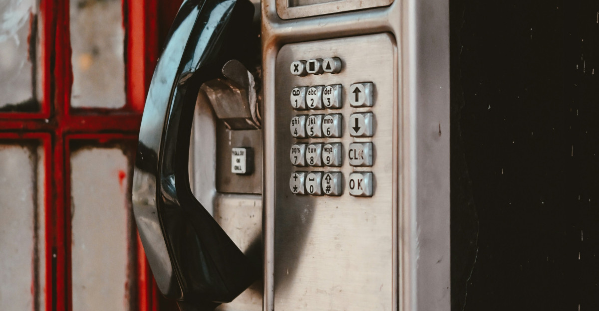 an old fashioned phone is attached to a wall
