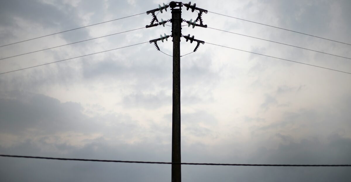 a telephone pole with power lines in the background