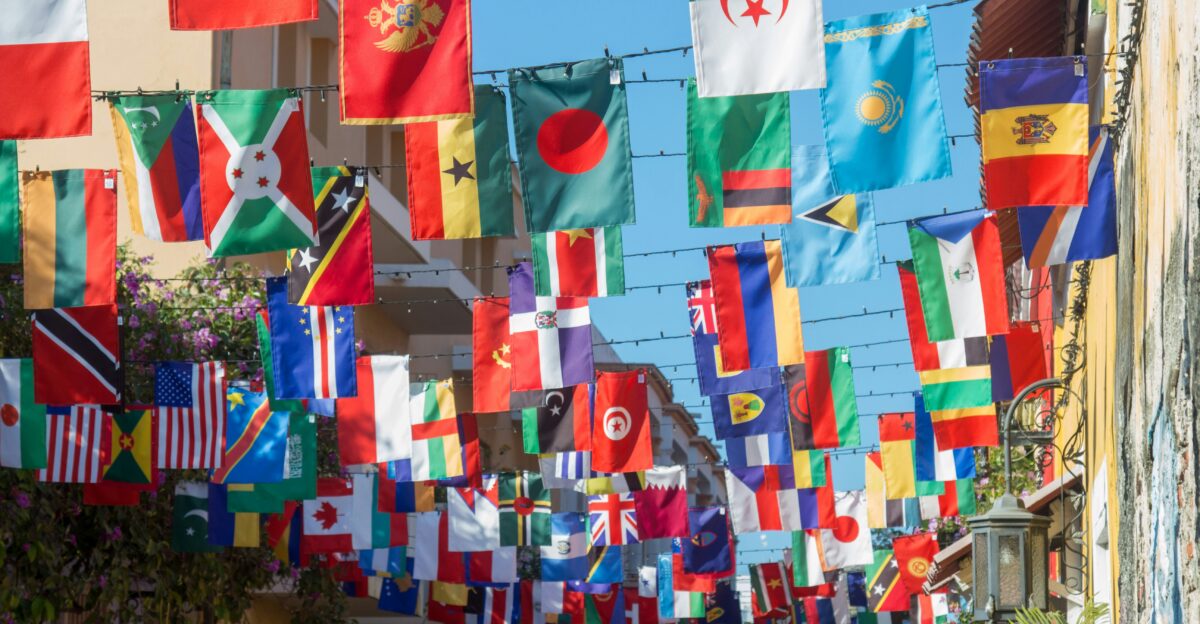 a wall with many flags from it
