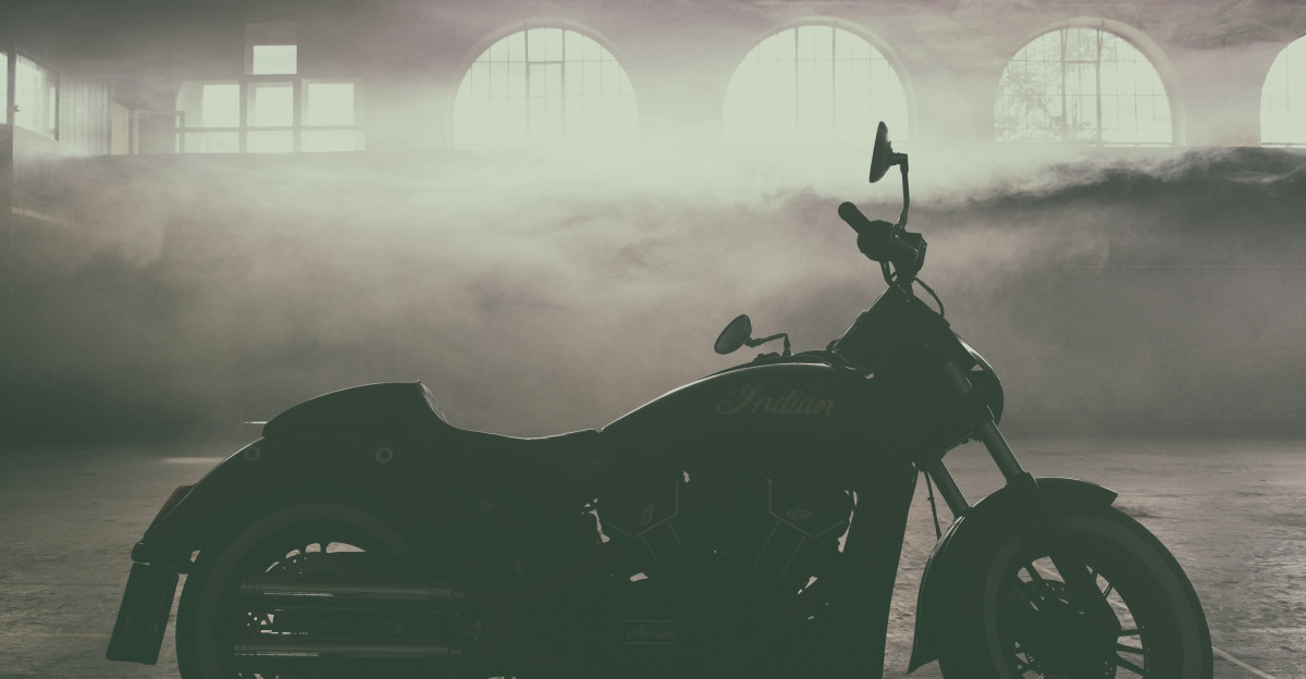 a black car in a foggy room