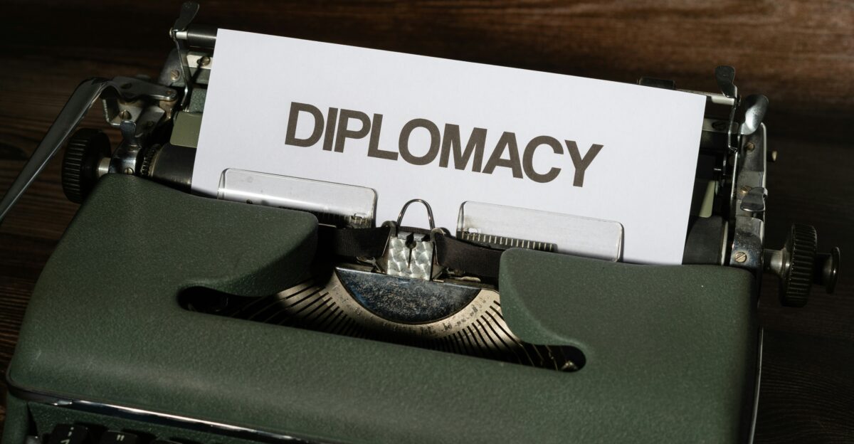 a close up of a typewriter with a piece of paper on it