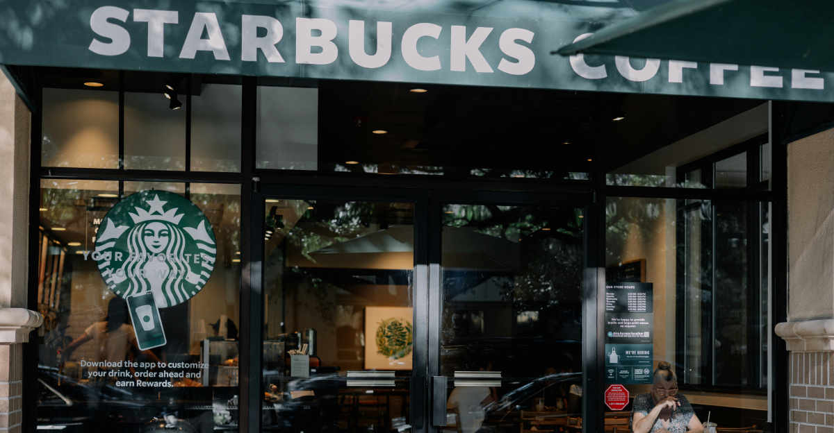 a starbucks coffee shop with a person sitting at a table