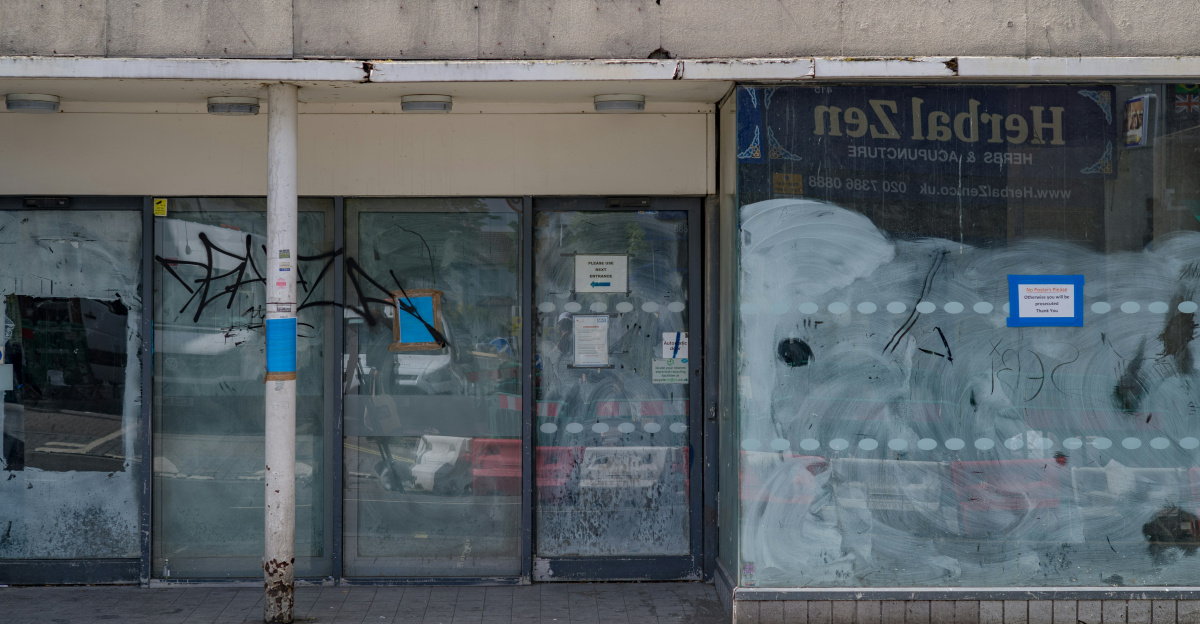 a store front with graffiti on the windows