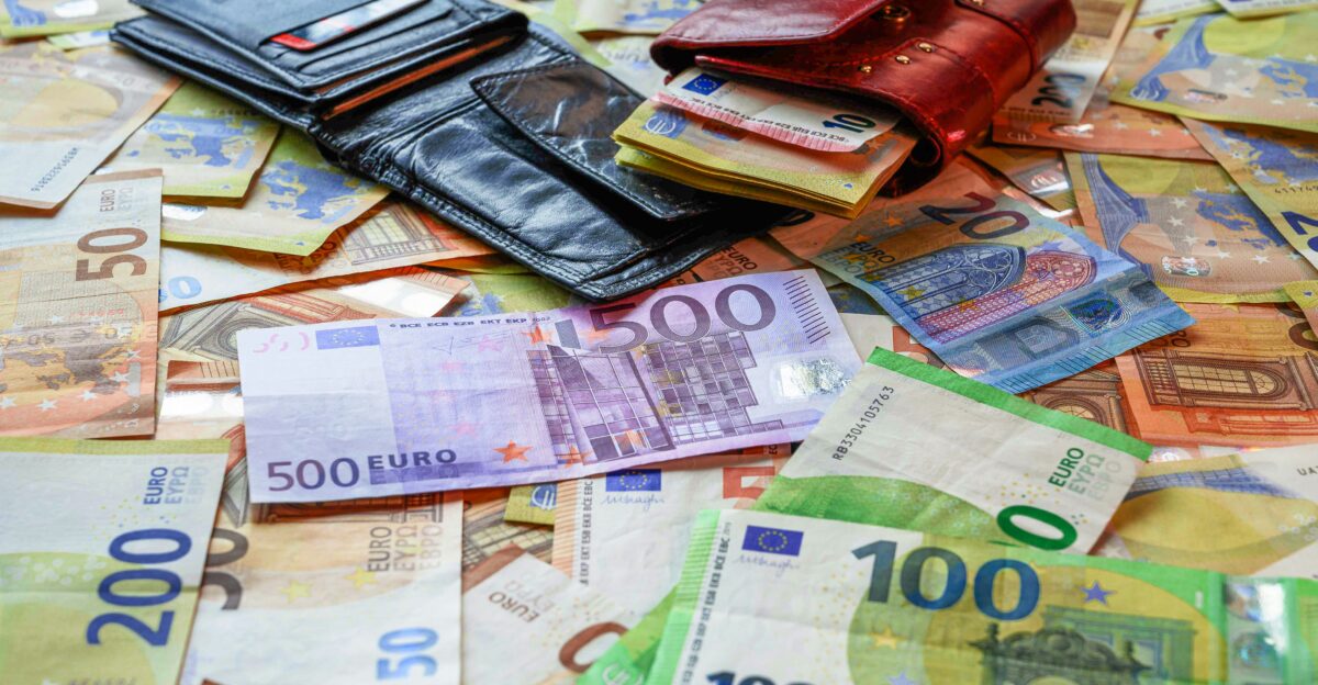 a pile of money sitting on top of a table