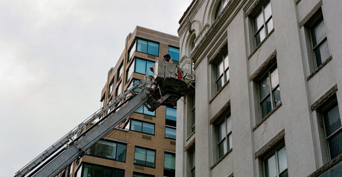 a person on a ladder on a building